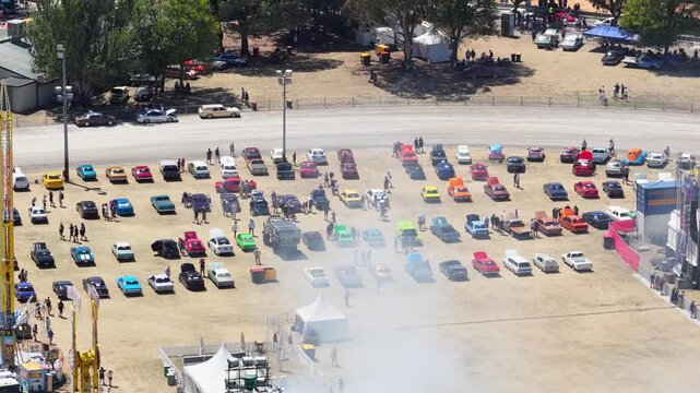 Aerial View of Modified Cars Performing Burnouts at Summernats Festival