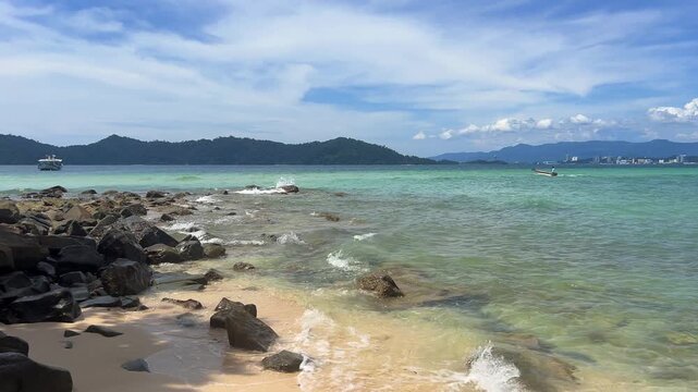 Landscapes of Manukan Island, part of the Tunku Abdul Rahman National Park in Sabah, Malaysia. Kota Kinabalu. Soft white sand. Clear turquoise water. The beach is surrounded by dense jungles. 4К