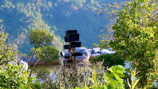 Tranquil Morning Atmosphere with Watermill and Tropical Foliage, Aesthetic Garden Design with Waterwheel and Majestic Mountain View