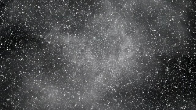 Gritty, chaotic gray dust particles and debris exploding in a centrally lit cloud against a dark background, creating an intense, abstract atmospheric grunge texture.