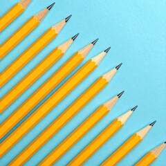 Yellow pencils diagonally arranged on blue