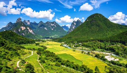 A picturesque landscape of lush green mountains and valleys under a bright blue sky filled with puffy white clouds. A serene scene