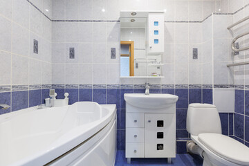 modern bathroom room with toilet and washing machine
