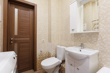 modern bathroom room with toilet and washing machine