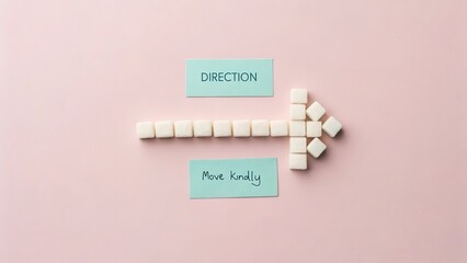 Sugar Cubes Form Arrow Indicating Direction With Text