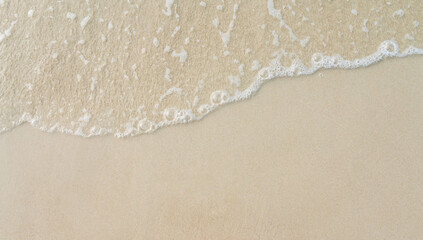 beautiful beach with  large wave crashing onto the shore