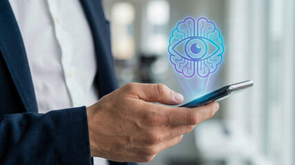Ai automation high level planning concept with digital eye icon over smartphone screen in businessman hand showing future technology vision