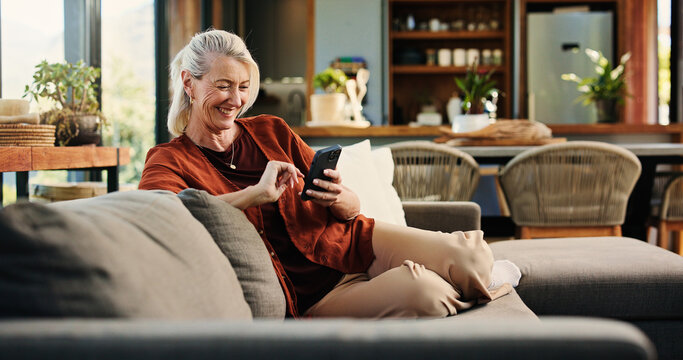Old woman, phone and laugh on sofa with texting, notification and funny chat in living room at house. Person, smartphone and happy with mobile app, contact and social network on couch at apartment