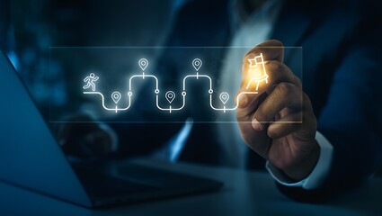 businessman interacting with digital flowchart on laptop screen at night