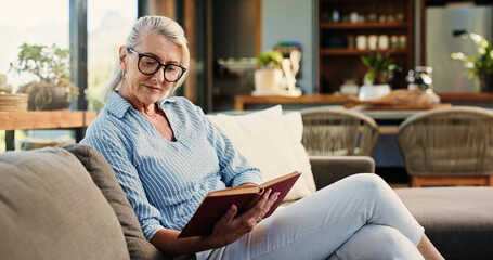 Reading, book and senior woman in home with glasses, calm and literature insight on weekend rest. Free time, knowledge or mature person with specs, relax and information guide on Sunday afternoon.