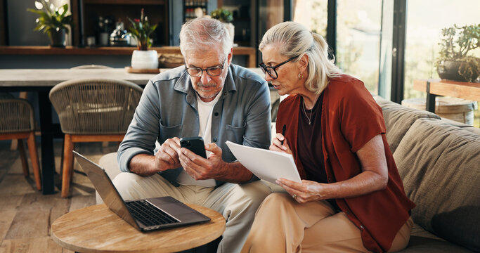 House, documents and old couple with smartphone, laptop and mortgage with pension fund. Budget, man and woman on couch, cellphone and digital app for banking statement, savings or asset management