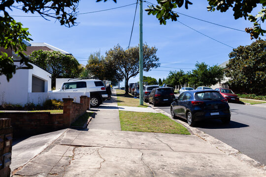 cars parked on roadside in Australian city suburb