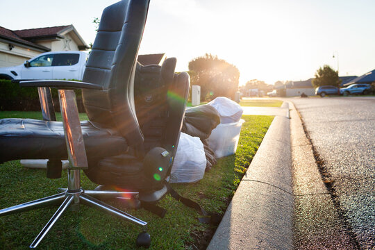 pile of junk and household rubbish on the kerbside for pickup during annual council cleanup  