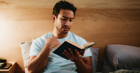 Night, reading book and man in bedroom, relax and literature with entertainment. Evening, home or person with novel, reaction or cozy activity with knowledge, comfortable or fantasy with storytelling