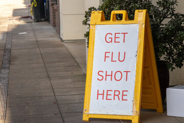 A sign advertising flu shot