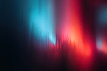 Vertical bands of blurred blue and red light against a dark background, abstract and ethereal