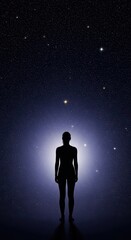 Fototapeta premium Silhouette of a human form stands illuminated against a dark, star-filled night sky