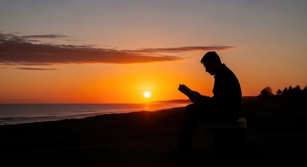 Silhouette of individual engrossed in reading material against vibrant ocean sunset backdrop