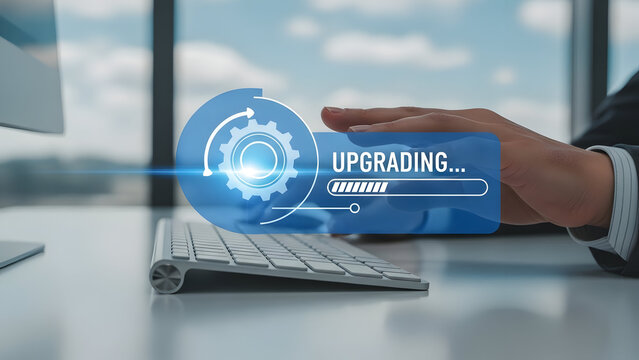 Businessman upgrading technology on computer with futuristic interface on screen