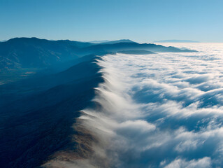 Scenic Mountain Range with Blue Sky and White Clouds Aerial View