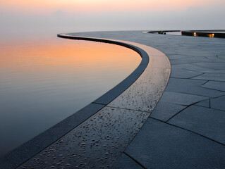 Minimalist Curving Walkway with Reflections at Dusk Serene Gray Stone Texture