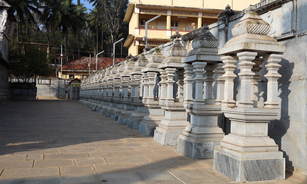 Padukas or footprints of Jain monks or tirthankaras placed in symmetrically shaped shrines at Humcha Jain temple in Karnataka, India.