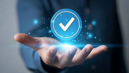 Hand holding blue check mark icon isolated on white background.