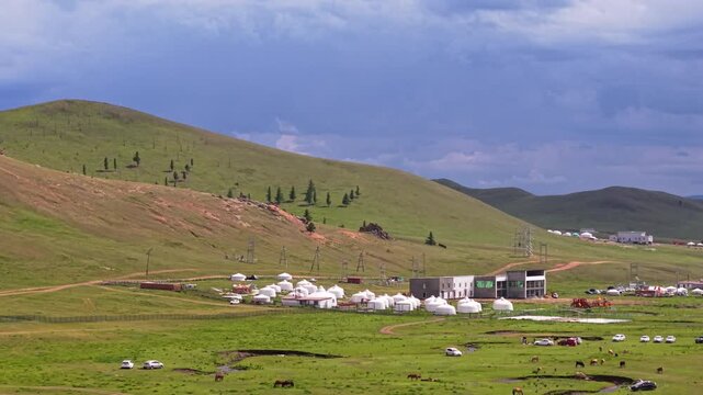Rock Formations Framing Traditional Yurts Nestled Among Rolling Grasslands, Capturing Scenic Landscape Of Gorkhi-Terelj National Park, Mongolia
