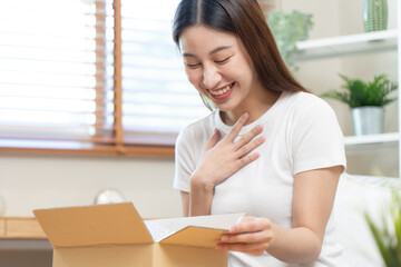 person unboxing package shopping online via internet at home
