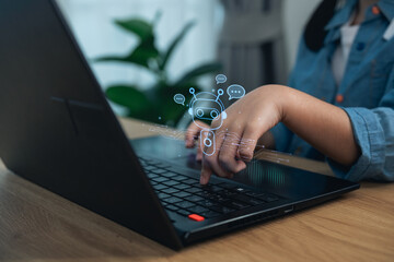 Close up girl hand using laptop with virtual AI chatbot robot. Concept of artificial intelligence,...