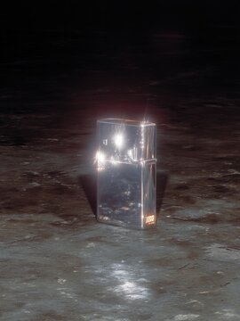 Una caja met&aacute;lica brillante se alza sobre una superficie oscura y reflectante, capturando la luz en un halo de misterio.