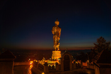4. The golden Buddha statue at Wat Khao Noi welcomes the sunrise, symbolizing faith, tranquility, and the cultural heritage of Nan.