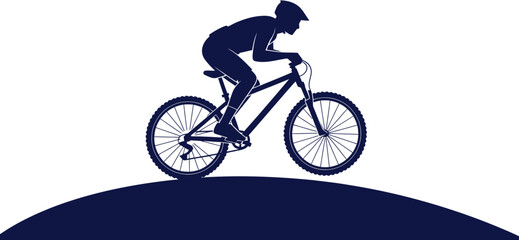 Fototapeta premium Silhouette of a person riding a mountain bike on a hill