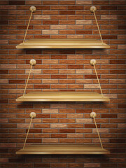 Wooden shelves on brick wall
