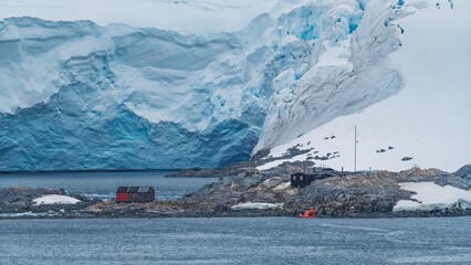 Port Lockroy Antarctica Penguin Post Office Orange Shuttle Parked. Remote British Science Station. Penguin Colony Habitat Frozen Landscape