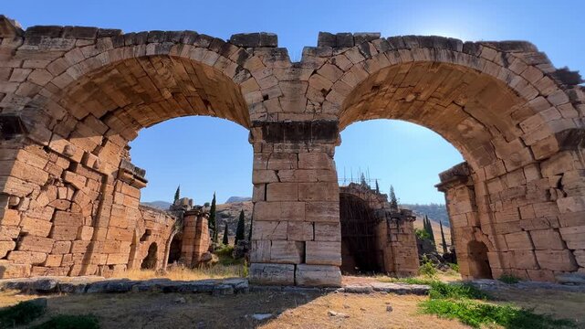 HIERAPOLIS in Denizli, TURKEY, August 13, 2024: The ancient city of Hierapolis near Pamukkale, against the backdrop of nature and mountains. The Phrygian period.UNESCO.4K