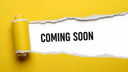 A torn paper revealing a coming soon message on a yellow background