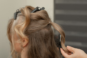 Adult Woman with Wavy Hair Touching Neck in Profile View © Ирина Санжаровская