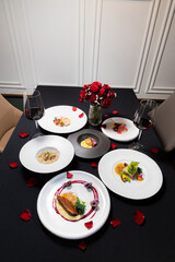 A beautifully arranged dining table with exquisite food and drink