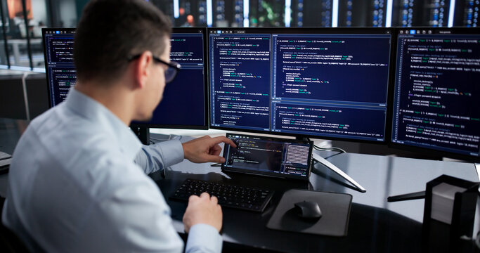 Hispanic Programmer Developing Software On Mini Computer