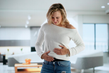 Young Woman Receives Treatment For Stomach Pain