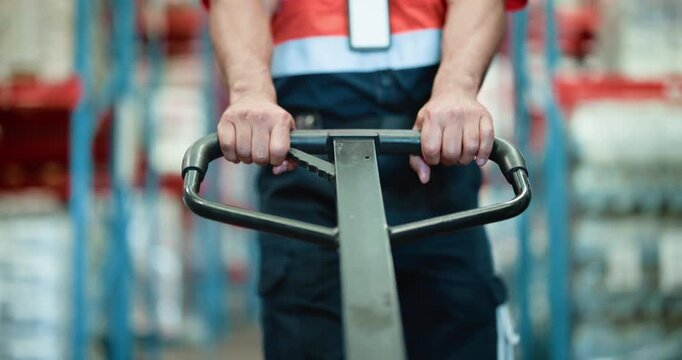 Logistics, warehouse and hands with pallet truck, loader and restock for goods distribution or pull. Moving, cargo and person with equipment for supply chain in factory, merchandise and shipping