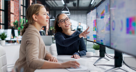 Young Latina Woman Analyzing Financial Data On Computer