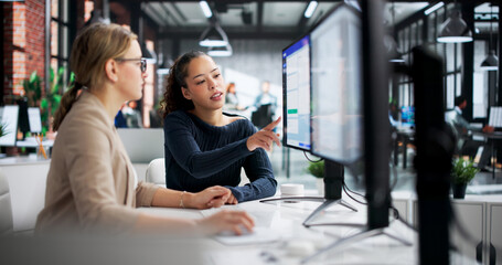 Woman At The Office Using Corporate Invoice Software On Computer