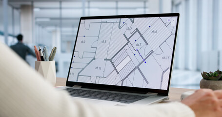 Young Female Architectural Engineer Sketches Blueprint