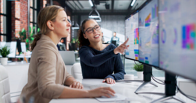 Young Latina Woman Analyzing Financial Data On Computer