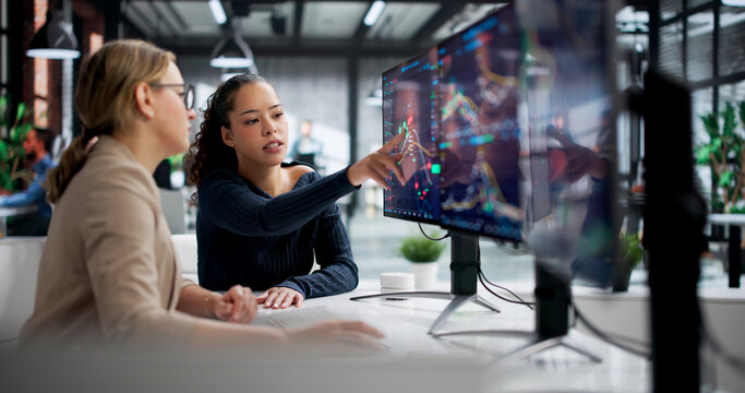 Successful Latina Broker Analyzing Stock Market Trends