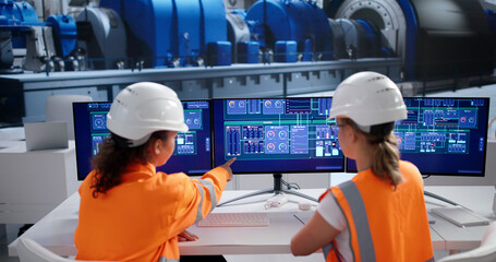 Woman Engineer Supervising SCADA System