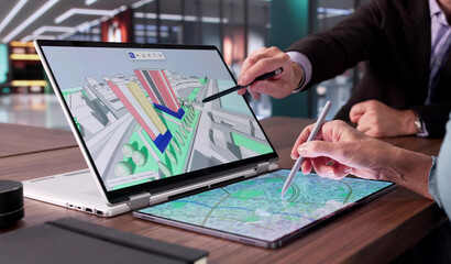 Multicultural Engineer And Real Estate Professional Inspecting GIS