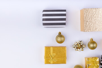 Various christmas presents with decorative baubles arranged by copy space on white background